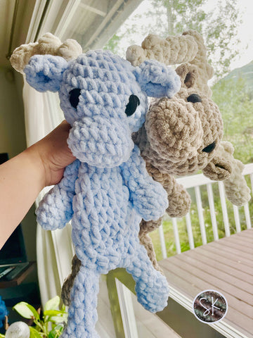 Moose Baby Snugglers in colors Baby Blue and Baby Sand