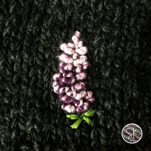 Lupine Chunky Hats, an embroidery close up